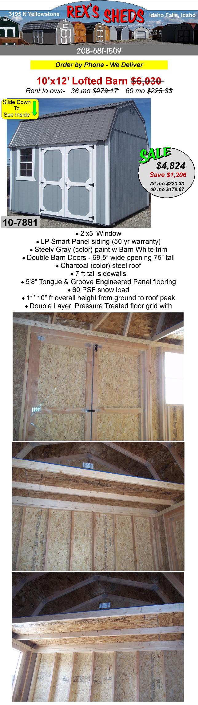 steely_gray_color_barn_shed_with_barn_white_trim_and_double_barn_doors_a_window_and_an_overhead_loft_at_each_end_a_charcoal_color_steel_roof