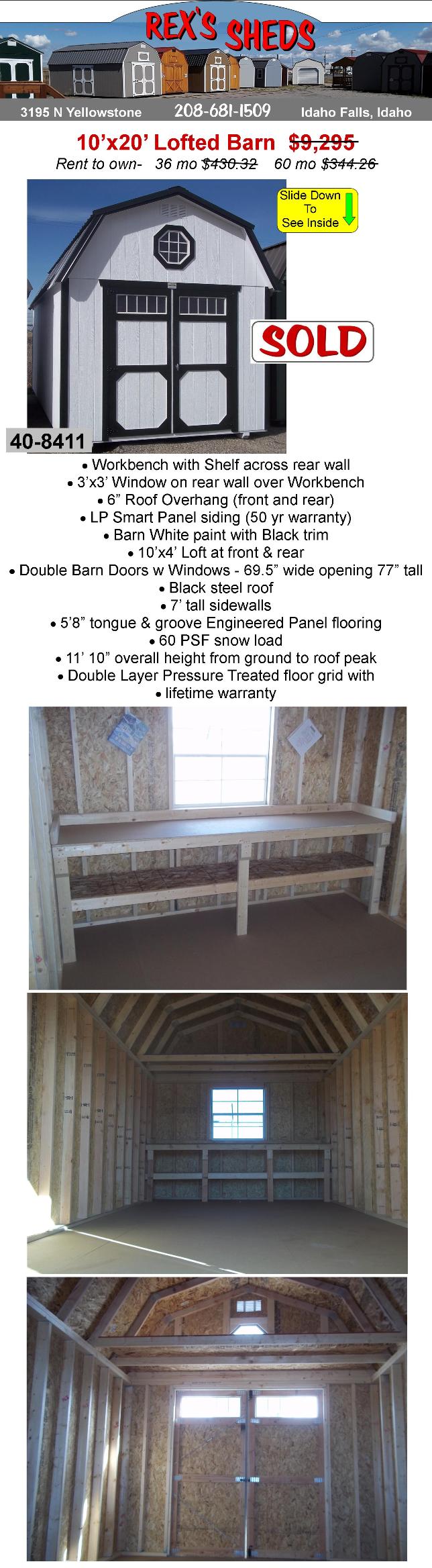 large_shed_with_barn_style_roof_painted_barn_white_with_black_trim_built_in_workbench_2_windows_and_black_steel_roof_double_barn_doors_and_an_overhead_loft_at_front_and_rear