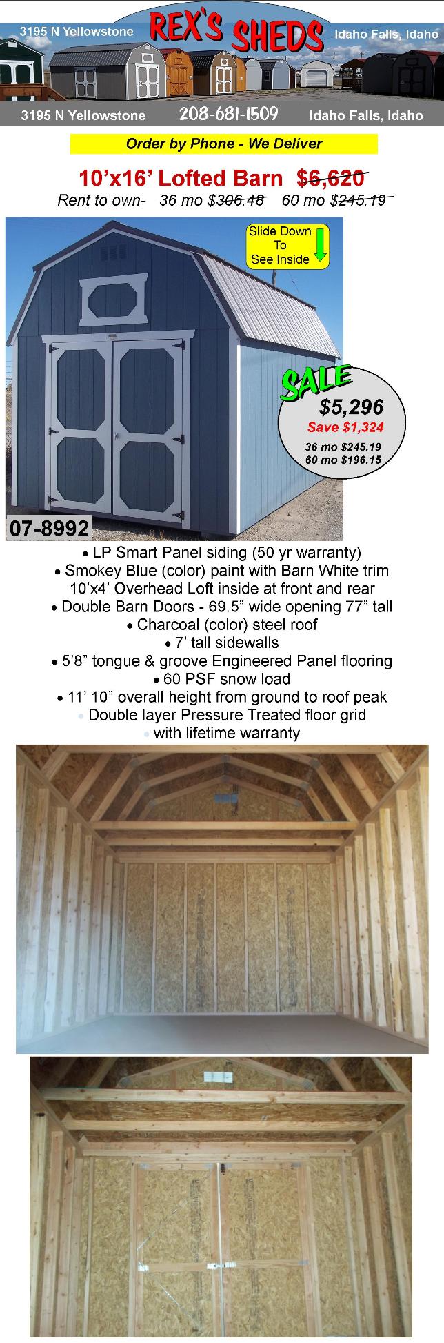 barn_style_shed_with_smokey_blue_color_paint_barn_white_trim_double_barn_doors_an_overhead_loft_at_front_and_rear_charcoal_color_steel_roof