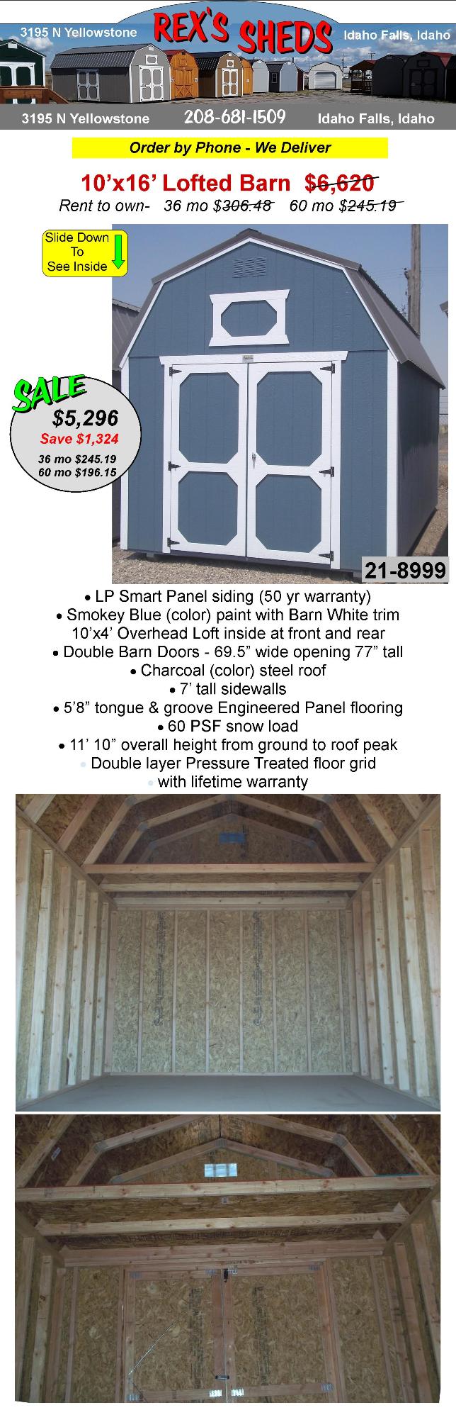 barn_style_shed_with_smokey_blue_color_paint_barn_white_trim_double_barn_doors_an_overhead_loft_at_front_and_rear_charcoal_color_steel_roof